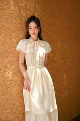 Pleated Silk Midi Dress with Bow-Tie Neckline and Layered Hem for Elegant Occasions